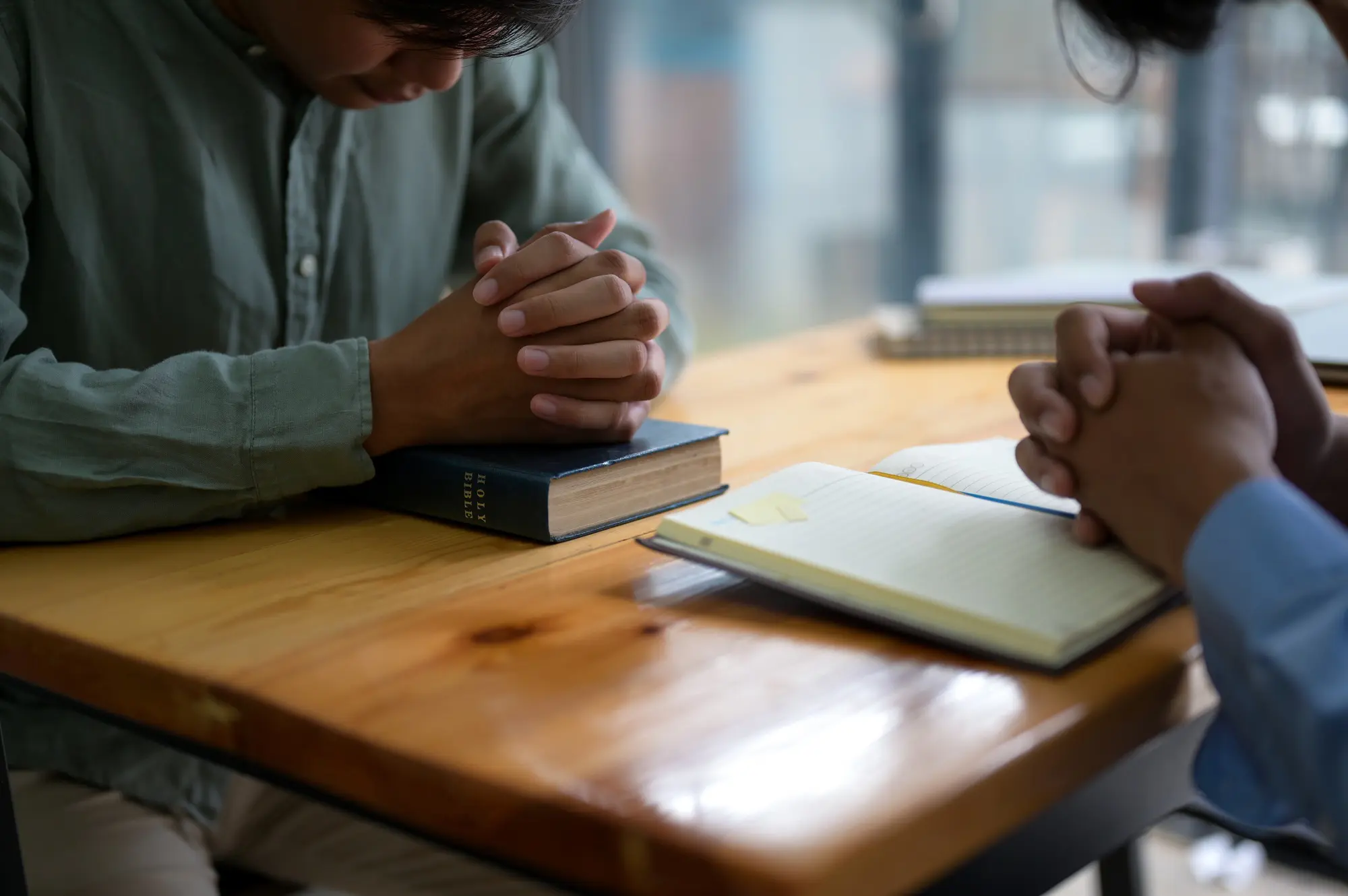 Cropped shot of Worshiping god with the bible.