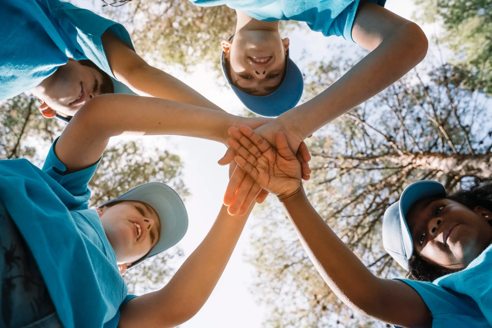 Group of kids stacking hands